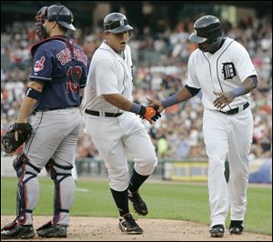 Miguel Cabrera is congratulated by Marcus Thames, right,
after Cabrera hit a two-run homer in the third inning.