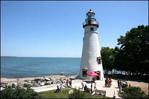 The Marblehead Lighthouse and picturesque lakefront draw vacationers looking to kick back and relax. 