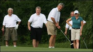 Jamie Farr, left, Jim Murray, Gary Benz, Alan Brass, and pro golfer Mhairi McKay enjoy the Toledo Edison/ProMedica Health System Pro-Am.
<br>
<img src=http://www.toledoblade.com/graphics/icons/photo.gif> <font color=red><b>VIEW</font color=red></b>: <a href=