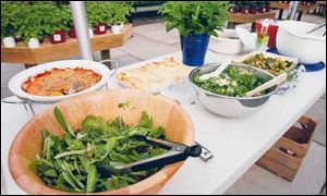 Salads and home-cooked dishes were served at the Slow Food Maumee Valley June potluck.
