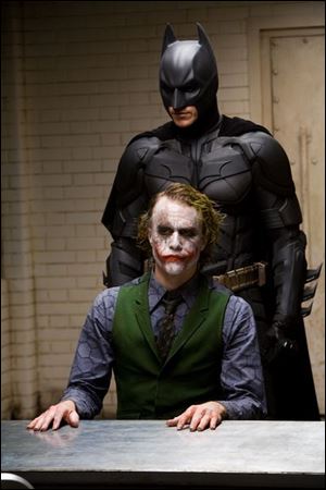 Christian Bale, above, as Batman and Heath Ledger as the Joker in The Dark Knight.