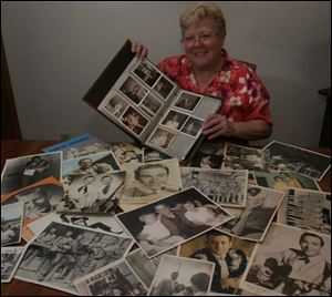 Sharon Chinni with photos and memorabilia of country artists.
