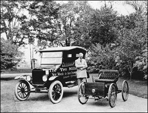 Henry Ford admires the 1896 Quadracycle, at right, and his company s 10 millionth vehicle, a Model T, in this company photo.

