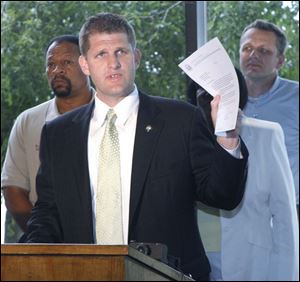 Rep. Matt Szollosi (D., Oregon) speaks at a news conference encouraging Juvenile Court Judge Denise Cubbon to resume contract negotiations with the United Auto Workers. (THE BLADE/HERRAL LONG) 