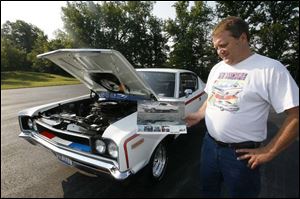 Joe Badger of Genoa owns 11 cars and trucks of various vintages and is participating in Genoa's three 'Super Cruise-Ins.'