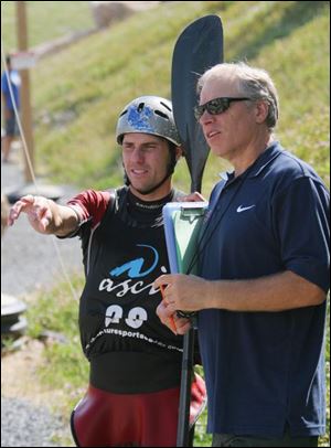 Scott Parsons talks with his coach, Silvan Poberaj, during an Olympic training session. Parsons also competed in the 2004 Olympics.