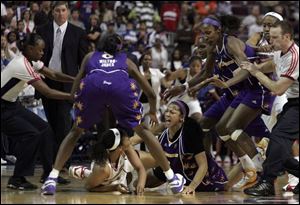 The Shock's Plenette Pierson, on floor at left, scuffles with the Sparks' Candace Parker, both of whom were ejected.