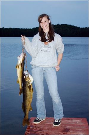 Madison Mehl, 13, of Haskins was used to catching panfish until she hooked a monster walleye of more than 32 inches.