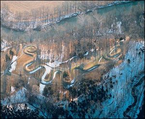 Serpent Mound in Adams County, the world s largest effigy mound, is strikingly highlighted by a low winter sun.