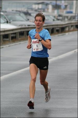 Petra Teveli gets ready to run the Olympic marathon for Hungary. Teveli ran for the University of Toledo, winning the MAC indoor mile championship in 2002. She qualified for the Olympics by recording a time of 2 hours, 35 minutes, 21 seconds.
