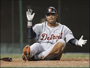 Detroit Tigers' Carlos Guillen celebrates after sliding home to score on Placido Polanco's ground out in the 13th inning early Thursday morning. The run broke a 12-12 tie and the Tigers went on to win 14-12.
