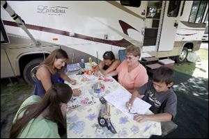 Clockwise from bottom left: Brionna Smith, 14; Susan Gotts and daughter Taylor Gotts, 13; Stephanie Brown, and Dylan Gotts, 9, at the Monroe County KOA.