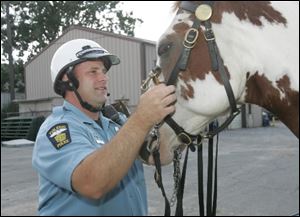 Officer Greg Zattau and KO get ready to ride.
<br>
<img src=http://www.toledoblade.com/graphics/icons/photo.gif> <font color=red><b>VIEW</font color=red></b>: <a href=