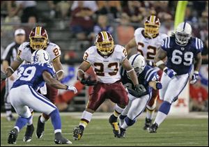 Washington Redskins running back Marcus Mason (23) runs for 11 yards against the Indianapolis Colts in the fourth quarter of the Hall of Fame football game Sunday in Canton, Ohio. 