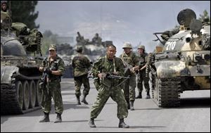 Russian soldiers block the road on the outskirts of Gori, northwest of the capital Tbilisi, Georgia, Thursday. 