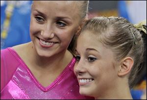 U.S. gymnasts Nastia Liukin, left, and Shawn Johnson pose afer the women's individual all-around competition at the Beijing 2008 Olympics in Beijing, Friday. Liukin won the gold medal, Johnson the silver. 