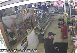 The man who robbed the Bush Quick Stop is described as 5 feet, 11 inches tall with blond hair and a beard and weighing about 160 pounds.
