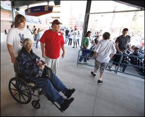 Nine months after receiving a grim prognosis, Randy Steele is alive and savoring each moment.
He marked July 4 by taking in a Mud Hens game, where he got a push from his son, Jonathon.
