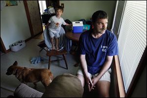Bill Hodnik of suburban Cleveland had spinal-fusion surgery after his insurer rejected a federally-approved artificial disc replacement favored by his doctor.