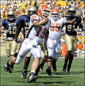 Bowling Green quarterback Tyler Sheehan runs for a touchdown against Pittsburgh. He hit 24 of 40 passes for 163 yards. Bowling Green defender Kenny Lewis strips the ball from Pittsburgh's Cedric McGee, and the Falcons recovered.