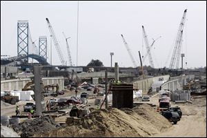 The complex will feature nine new bridges, including one that will loop around from the Ambassador Bridge s border-crossing area to feed southbound I-75.
