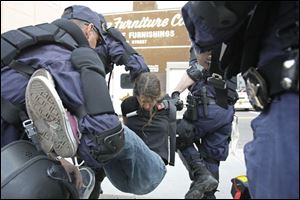 A protester is arrested during an anti-war protest at the Republican National Convention in St. Paul, Minn., on Monday.