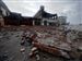 Large pieces of brick from a building in downtown Gulfport, Miss., which was damaged three years ago by Hurricane Katrina, is knocked down by winds from Hurricane Gustav on Monday.