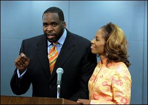Detroit Mayor Kwame Kilpatrick standing with his wife Carlita, addresses the media in Detroit, Thursday, Sept. 4, 2008. Kilpatrick took responsibility for his actions Thursday, hours after resigning as part of plea deals in two criminal cases, and left the door open for a return to public life.