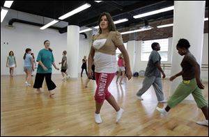 Christina Pietrzak, 12, of Toledo joins other students for dance class at the Toledo School for the Arts. Renovation of 22,000 square feet at the downtown building took nine weeks to complete and enabled the charter school to increase enrollment. 
