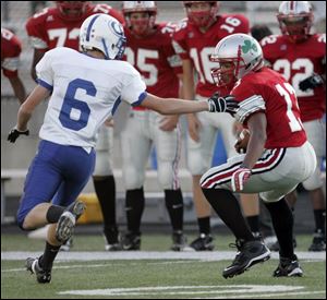 Central s Nate Hobbs shifts gears in order to fake out AW s Jordan Chipka on the way to a first-quarter touchdown.
<BR>
<img src=http://www.toledoblade.com/graphics/icons/photo.gif> <b>HIGH SCHOOL FOOTBALL WEEK 3:</b> View <a href=http://www.toledoblade.com/apps/pbcs.dll/gallery?Avis=TO&Dato=20080906&Kategori=SPORTS12&Lopenr=906009997&Ref=PH><b><font color=red> Central - Anthony Wayne</font color=red> </b></a> football photo gallery