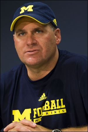 Rich Rodriguez is set to sign a contract to coach UM football 10 months after his hiring.