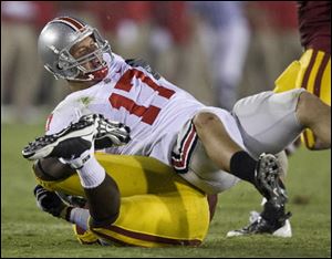 Ohio State quarterback Todd Boekman is sacked in the third quarter against Southern California in an NCAA college football game in Los Angeles, Calif., Saturday, Sept. 13, 2008.