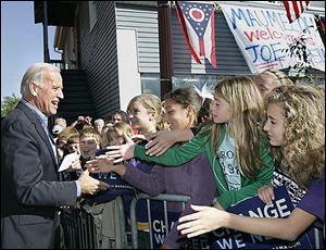 A group of youngsters greet Democratic vice presidential candidate Joe Biden during his campaign stop on W. Wayne St. in Maumee.