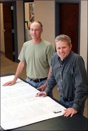 Mr. White, left, and Mr. Schlachter at their offices.
