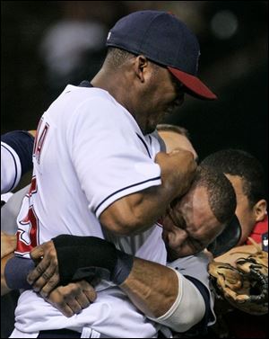 Indians hurler Fausto Carmona has Tigers outfielder Gary Sheffield in a headlock as the two go at it last night. The fireworks began after Carmona plunked Sheffield. He followed that up with a pickoff attempt. Sheffield jawed about it and charged the pitcher. Both benches then joined in.