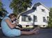 Sylvania-residents-feel-squeeze-to-vacate.jpg Maria Duran plays with Cougar in the front yard of her home, an apartment building she and her family share with four other low-income families. The pressure is on for them to move before their 30-day time frame is up because the city of Sylvania says the site is important for its gateway corridor project. The purchase agreement requires the buildings be empty at the time of the sale.