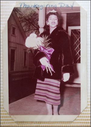 A photo from Janet Quinn- Wyatt s scrapbook shows her in November, 1957, as the first black football queen at Scott High School, after a tumultuous week at the Toledo school.