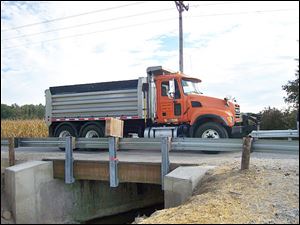 A Huron County truck tests the new bridge.
