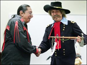 Slug: nbrs sittingbull09p  Date:  10/01/2008        The Blade/Andy Morrison       Location: Perrysburg      Caption: Ernie LaPointe, great-grandson of Sitting Bull, greets surprise guest Steve Alexander, Monroe, Mi., portraying General George Custer, as he speaks at Fort Meigs, Thursday, 10/02/2008.      Summary: