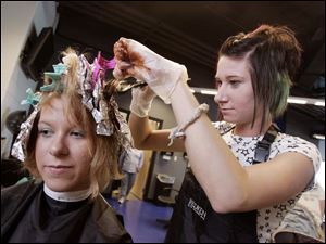NBRW penta02p   09/28/2008 The Blade/Dave Zapotosky Caption: Ashley Gase, 17, a student at the Penta Career Center in Perrysburg, Ohio, gets her hair colored by Samantha Horn 18, a Penta graduate, during the school's open house Sunday, September 28, 2008.  Gase is from Monclova Township.  Her home school is Anthony Wayne.  Horn lives in Whitehouse.  She graduated last year but attended the old Penta location.  Summary: Open house at the Penta Career Center.