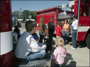 NBRN morenci09p Lisa Dutton/ The Toledo Blade   Morenci, MI 10/04/2008 Eight year old Aaron Newland waits patiently for his turn to take a fire truck ride during the open house. Morenci Fire Department  held an open house in honor their 175 years of service to the community.