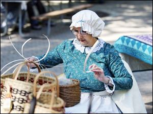 Slug: NBRE swamp09p                             Date: 10/05/2008             The Blade/Amy E. Voigt                     Location: Oregon, Ohio  CAPTION:  Maumee Bay Basket Weaver's Guild member Kathy Clark, from Oregon, weaves a basket during the Black Swamp Festival at Pearson Park, Packer-Hammersmith Center on October 5, 2008 in Oregon. The free event included crafts, artisan demonstrations and entertainment.
