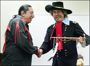 Slug: nbrs sittingbull09p  Date:  10/01/2008        The Blade/Andy Morrison       Location: Perrysburg      Caption: Ernie LaPointe, great-grandson of Sitting Bull, greets surprise guest Steve Alexander, Monroe, Mi., portraying General George Custer, as he speaks at Fort Meigs, Thursday, 10/02/2008.      Summary: