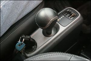 The Smart Car s ignition is at the driver s side, by the gearshift. The U.S. waiting list for the car grew to some 30,000.
