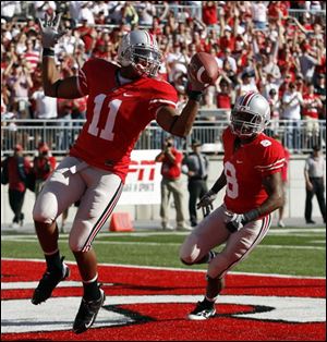 Etienne Sabino finds himself in the end zone after picking up a blocked punt and returning it 20 yards to give the Buckeyes a lead. It was the only time Ohio State made it to the end zone. 
<BR>
<img src=http://www.toledoblade.com/graphics/icons/photo.gif> <font color=red><b>VIEW</font color=red></b>: <a href=