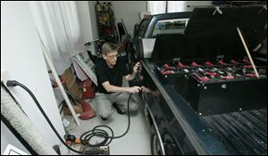 Al Compaan of Spencer Township has solar panels on his home, which he uses to charge his battery-powered vehicle.
