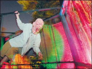 A scary character performs during a trial run at the house.