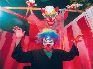 Dylan Hanf, above, in the haunted house at the Sylvania Township home of Nick Francis, 16. Nick s cousin, Max Simon, 14, is co-owner.