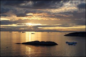 The midnight sun yields an array of colors. The island endures full days of darkness or daylight for months at a time.