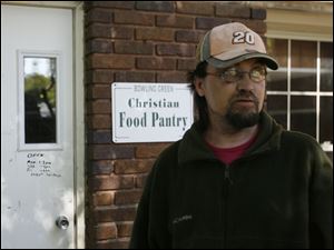 Wayne English of Bowling Green recently sought food pantry
assistance for his daughter and himself after he was laid off. (THE BLADE/JETTA FRASER)
<br>
<img src=http://www.toledoblade.com/graphics/icons/photo.gif> <b><font color=red>VIEW</b></font color=red>: <a href=" /apps/pbcs.dll/gallery?Avis=TO&Dato=20081020&Kategori=NEWS24&Lopenr=102009998&Ref=PH" target="_blank  "><b>State of Distress - Day 2 photos</b></a> 
